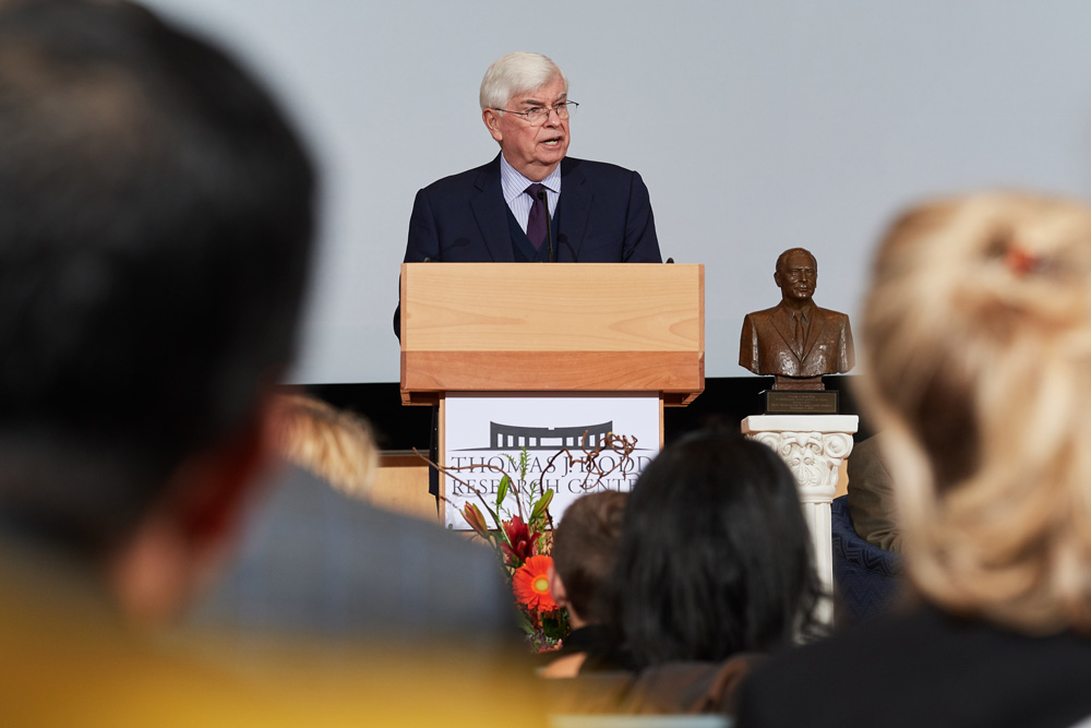 Christopher Dodd gives a speech at a podium. 