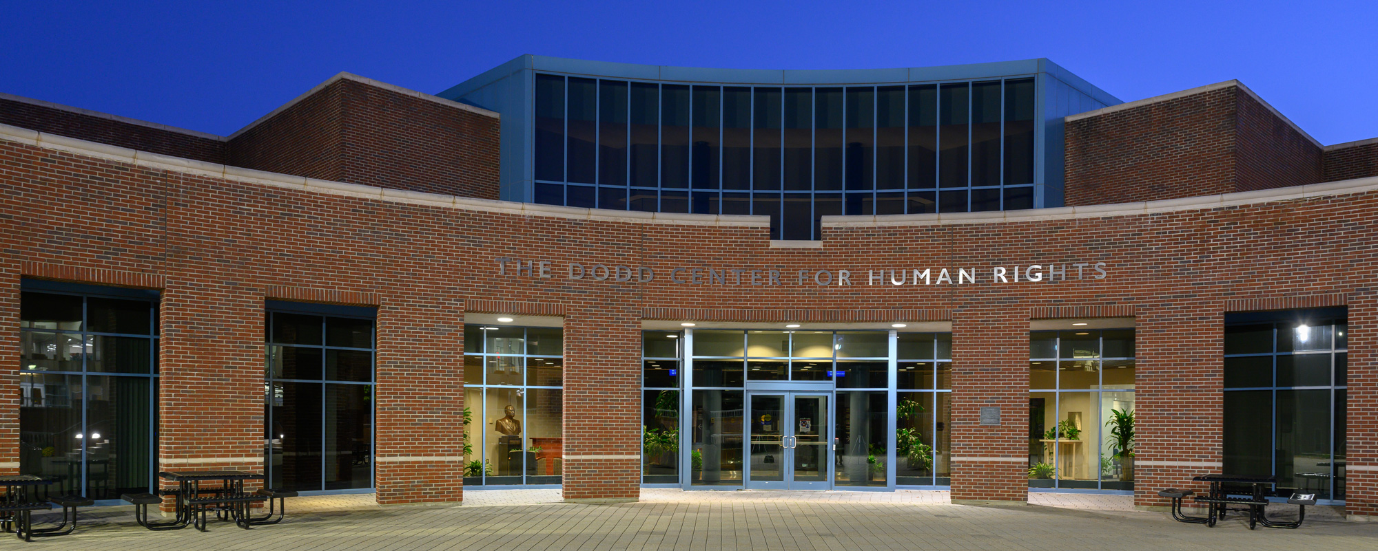 The Dodd Center for Human Rights building at night. 