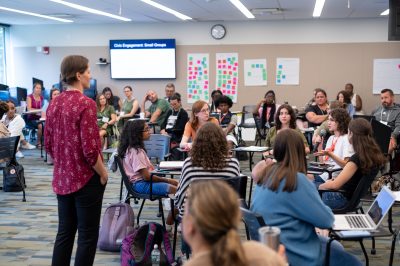 A large class discusses civic engagement.